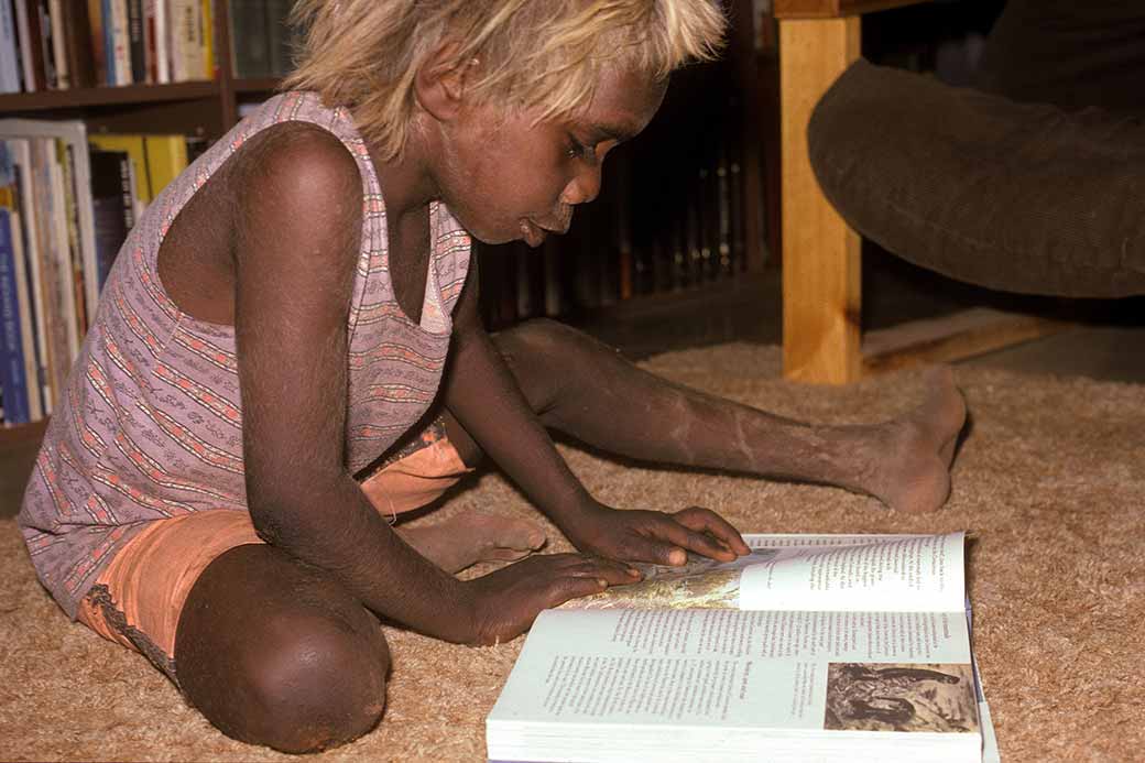 Boy reading a book