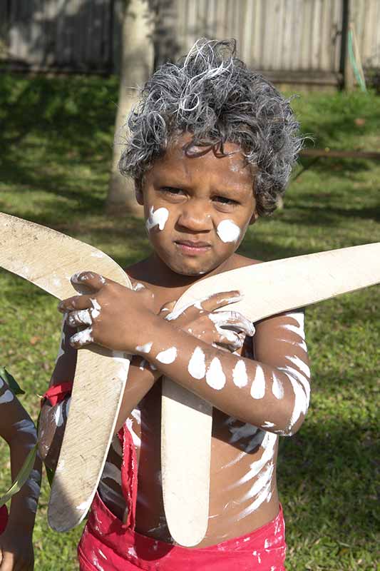 Boy with boomerangs