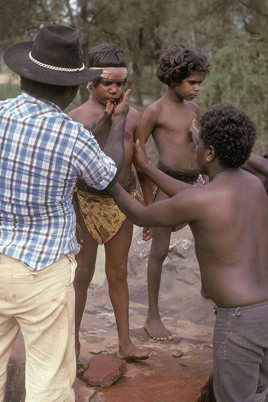 Boys being painted