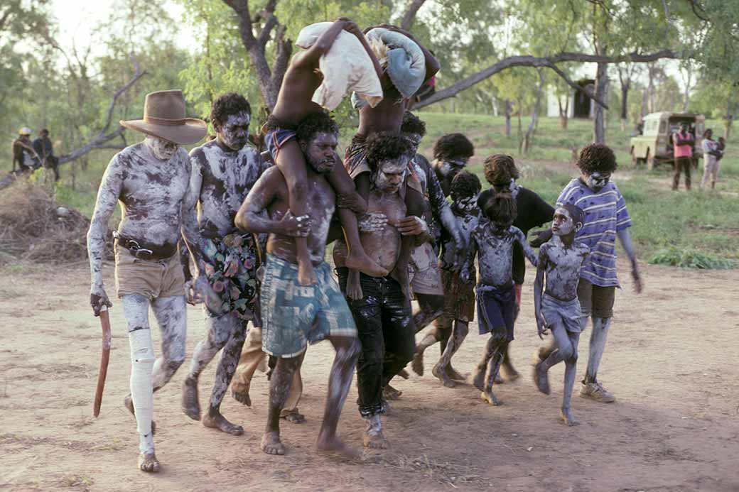 Initiates being carried