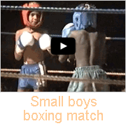 Small boys boxing match