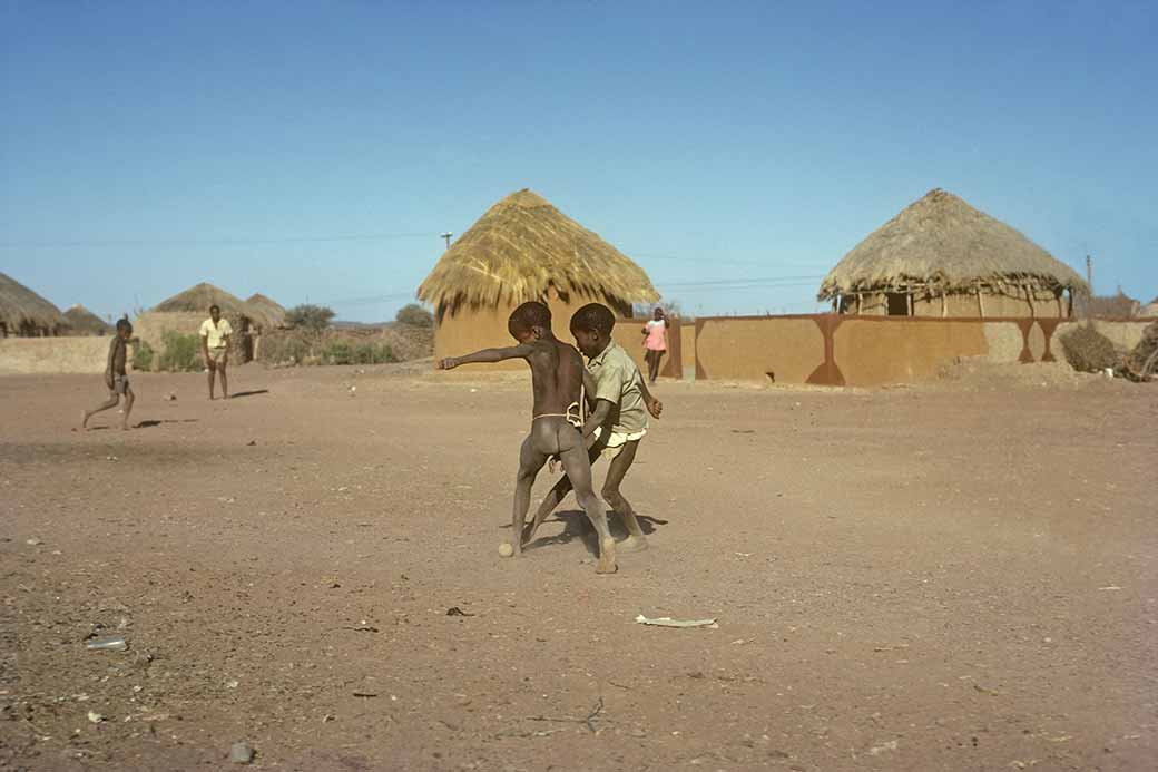 Boys playing football, Molepolole