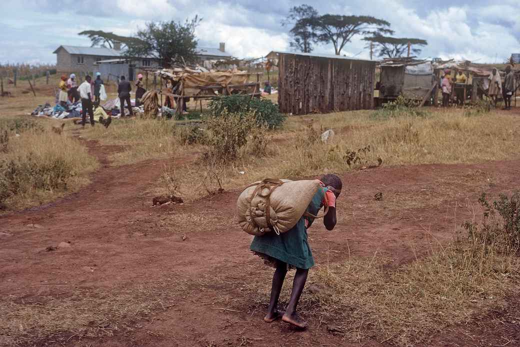 Girl carrying load