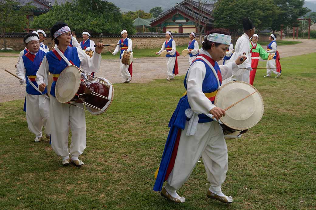 Women beating drums