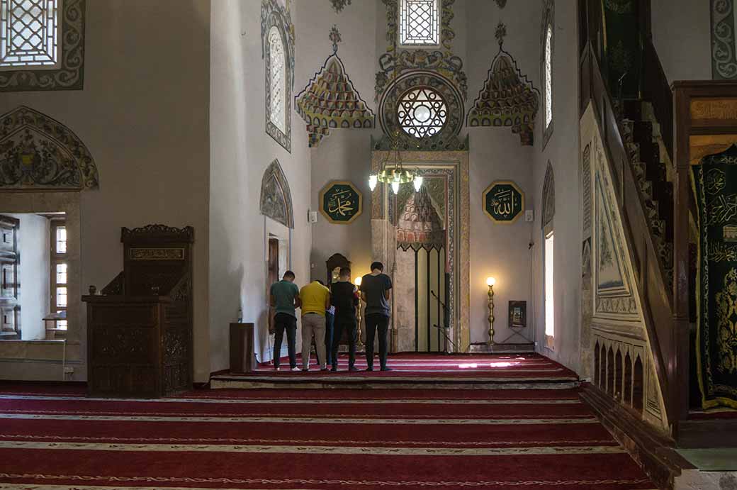 Men praying, Sinan Pasha Mosque