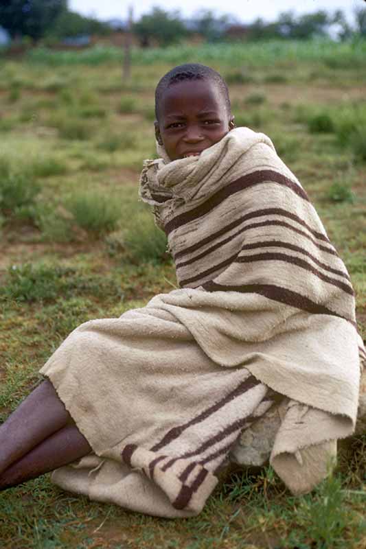 Boy in blanket