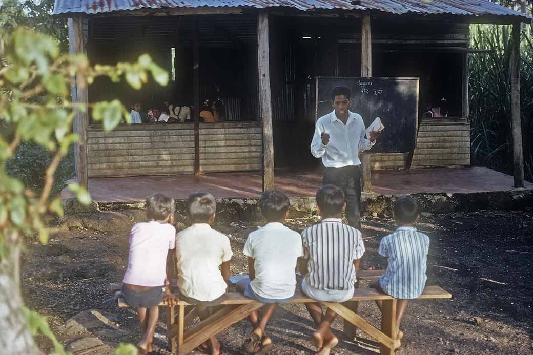 Teacher and students, Flacq