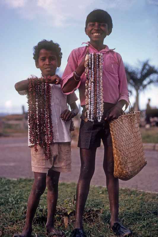 Boys selling shell necklaces