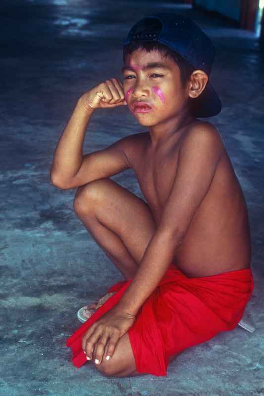 Young boy in red thu