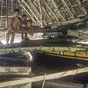 Boys in a canoe house, Magur