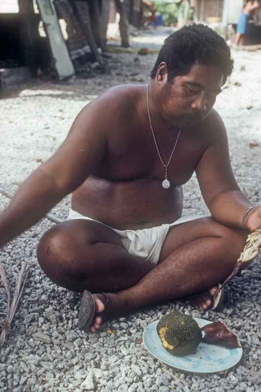 Man eating breadfruit, Sorol