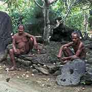 Two men and stone coins