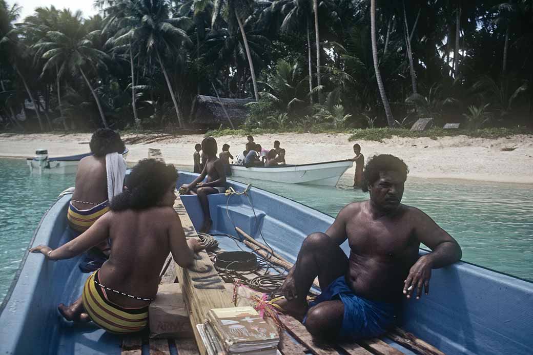 In longboat, leaving Falalop, Woleai