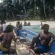 In longboat, leaving Falalop, Woleai