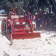 Demonstrating shovelling sand