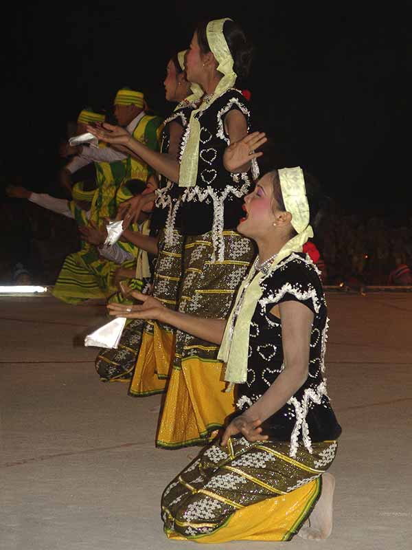 Women sing and dance