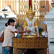 Worshiper pouring water