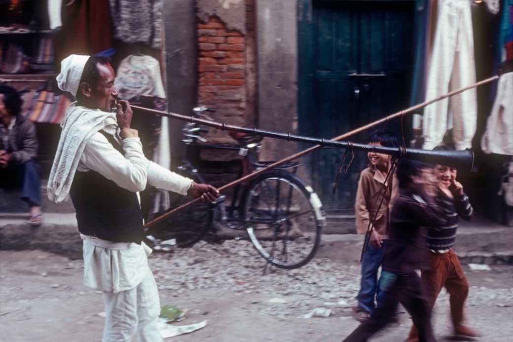 Playing a long horn, Kathmandu