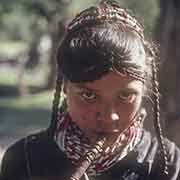 Kalash girl playing a flute