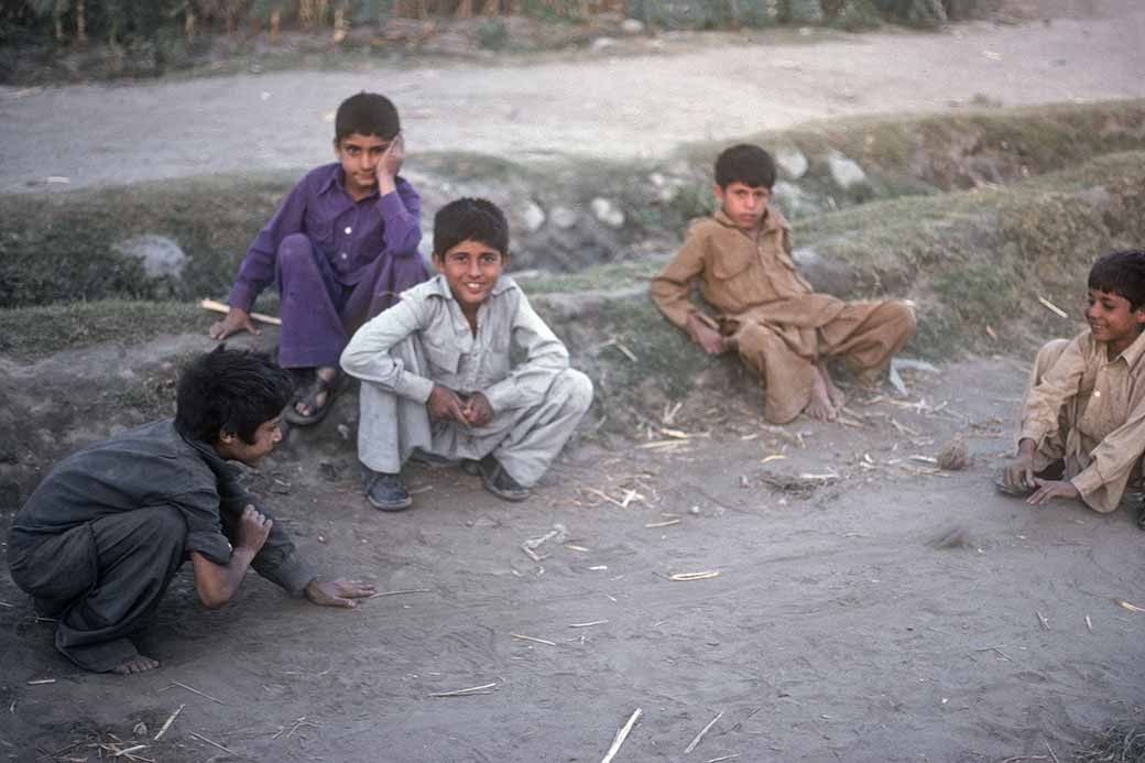 Boys playing marbles, in Gilgit