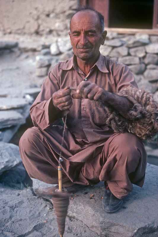 Man spinning wool