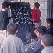 Two boys reading Urdu