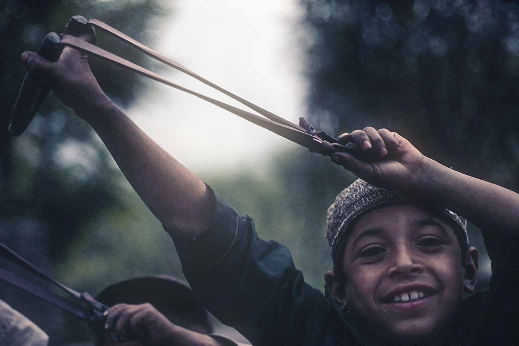 Boy with slingshot