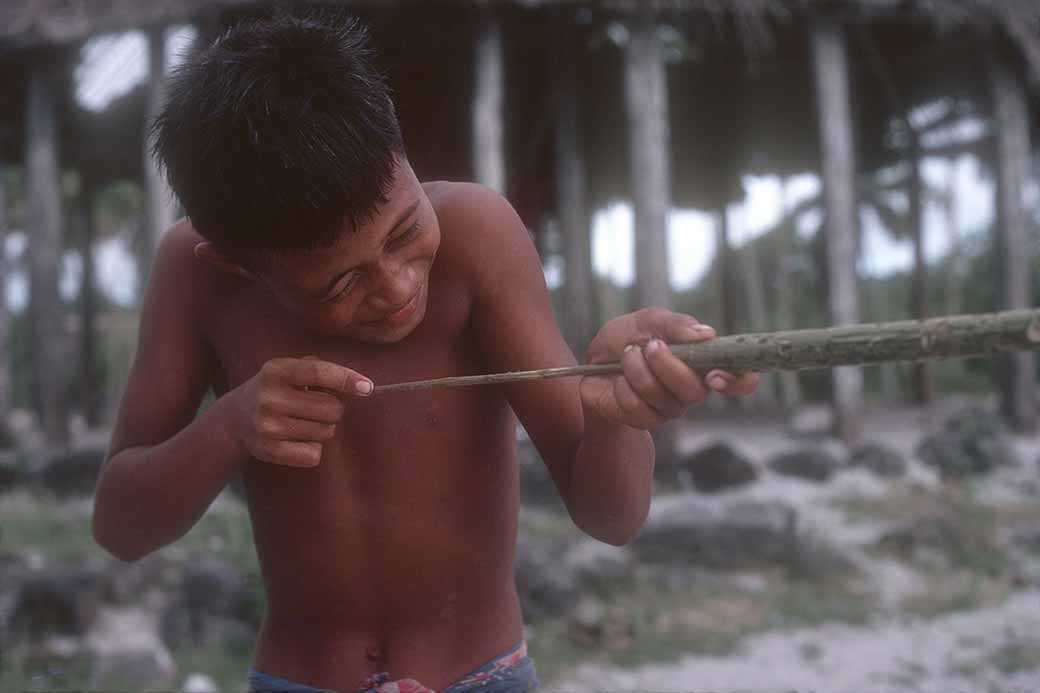 Boy with blowgun