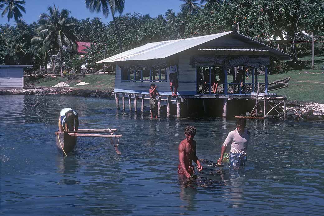 Fishermen with canoes