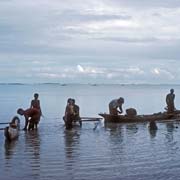 Fishermen with canoes