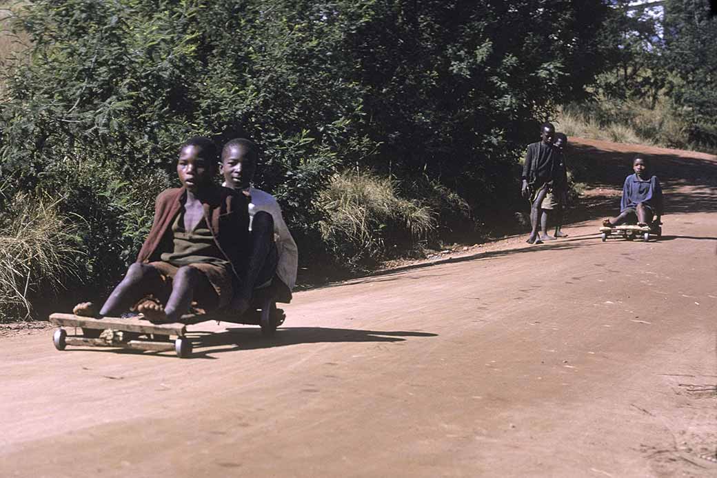 Boys race downhill