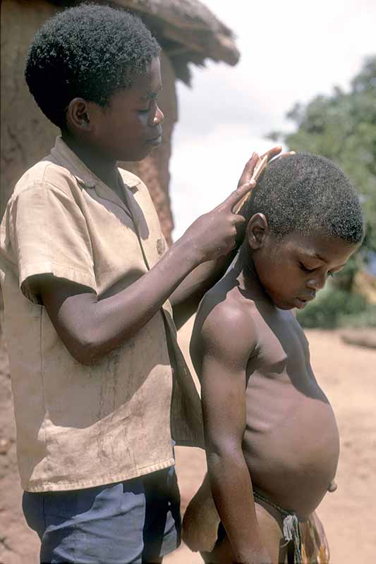 Combing his hair