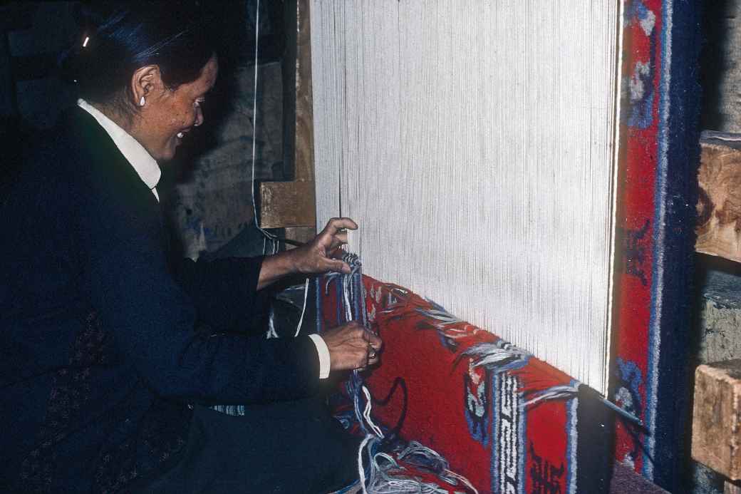 Weaving a carpet, McLeod Ganj