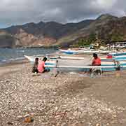 Men repairing their nets