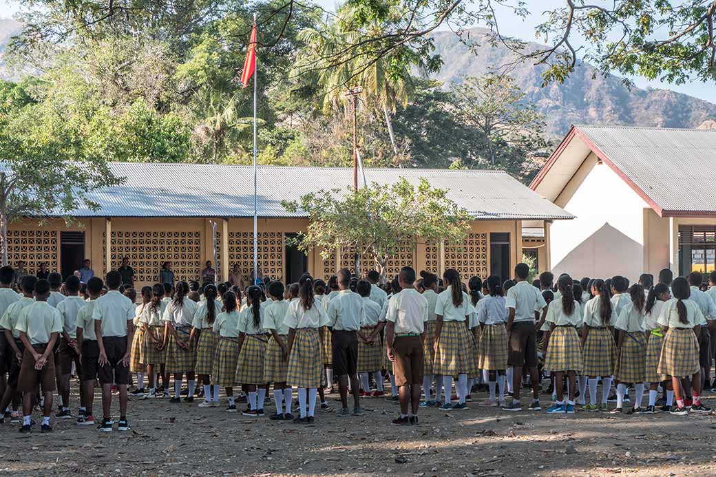 School assembly with the flag