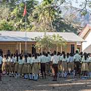 School assembly with the flag